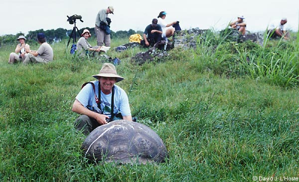 ECUADOR 2001 -- Marty Guidry and Galapagos Tortoise -- by David J. L'Hoste