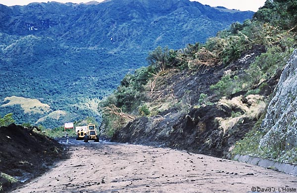 ECUADOR 2001 -- Small landslide being cleared near Papallacta --  by David J. L'Hoste