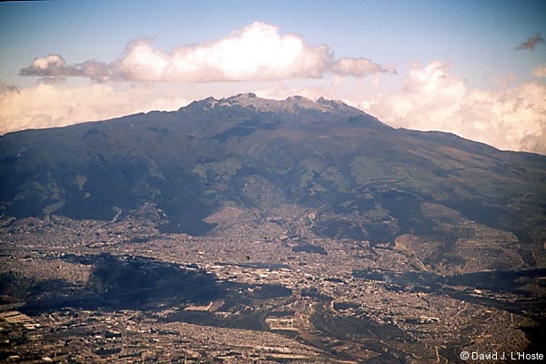 ECUADOR 2001 -- Ash-capped Pichincha looms over Quito --  by David J. L'Hoste